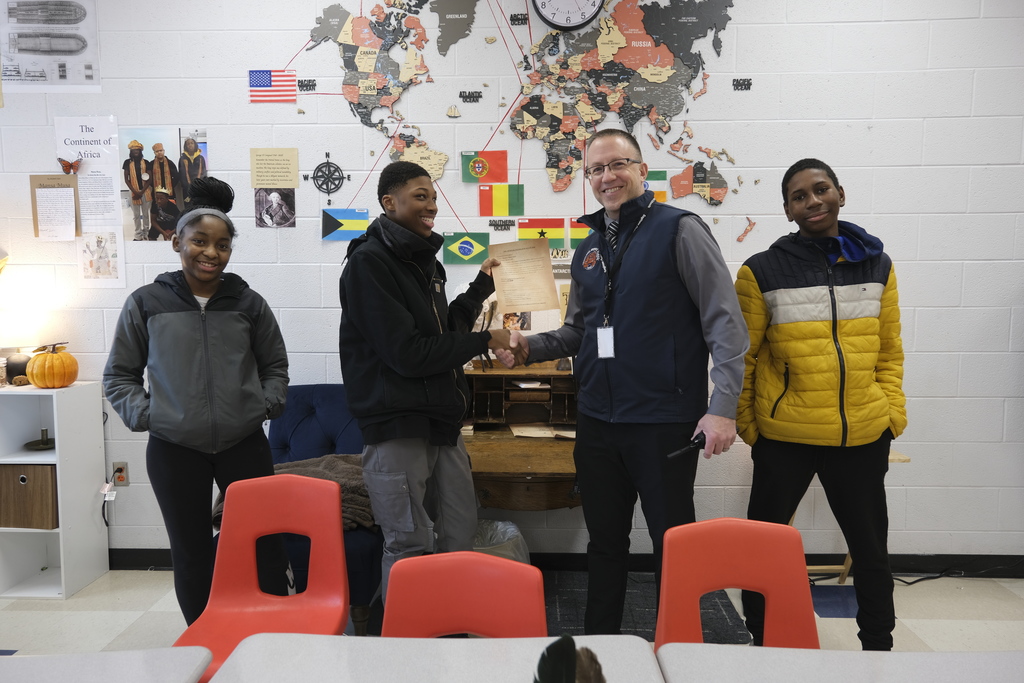 Students celebrate passing their first bill in history class