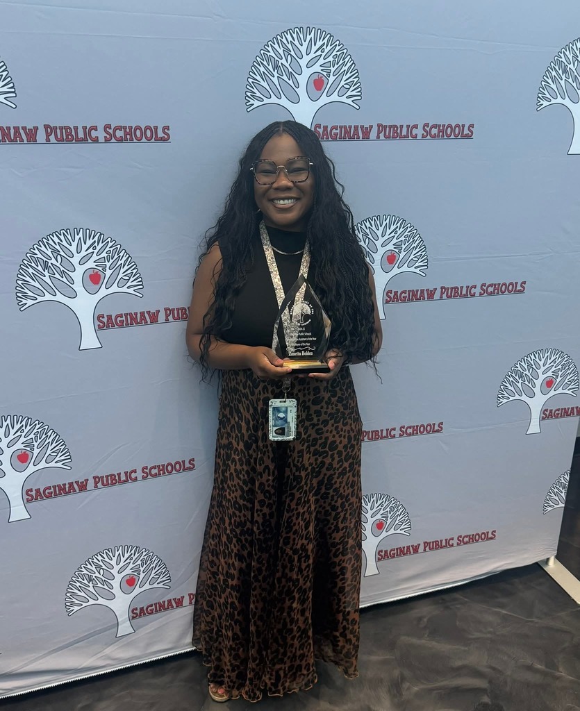 woman holding award for administrative assistant 