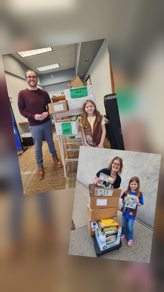 students standing by boxes of books