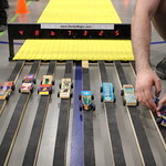 derby cars going down a ramp