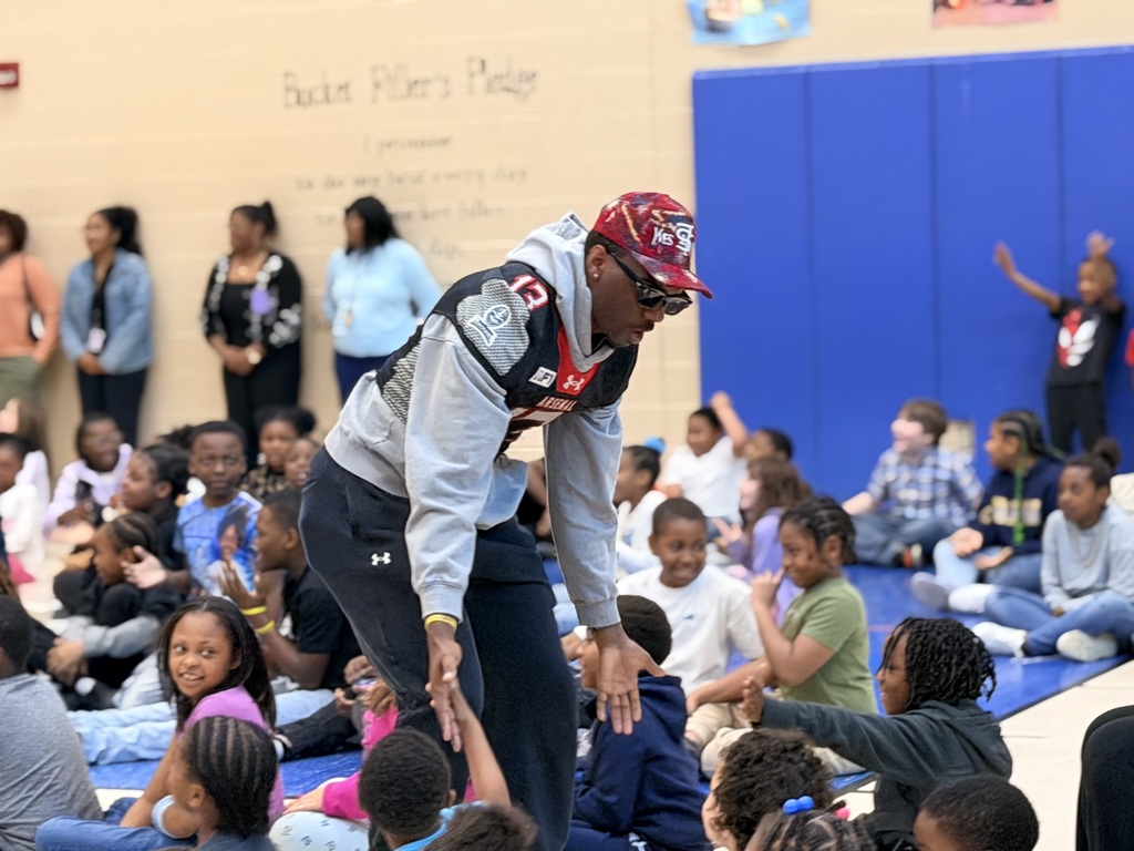 Michigan Arsenal football team visit Loomis students' assembly