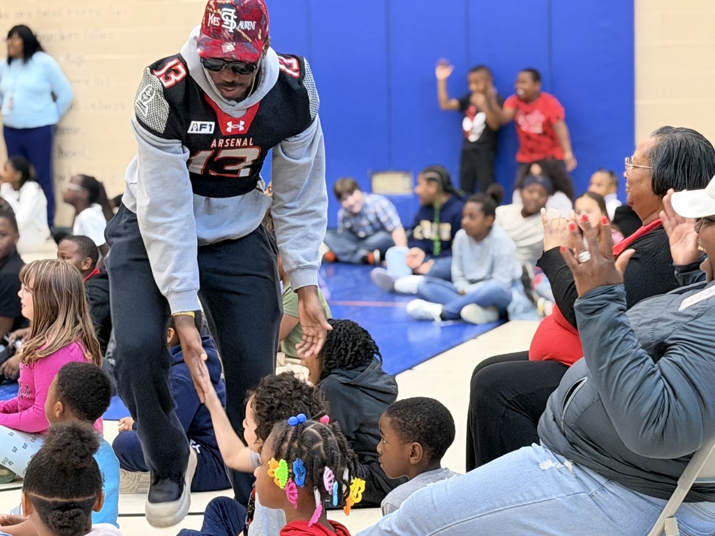 Michigan Arsenal football team visit Loomis students' assembly
