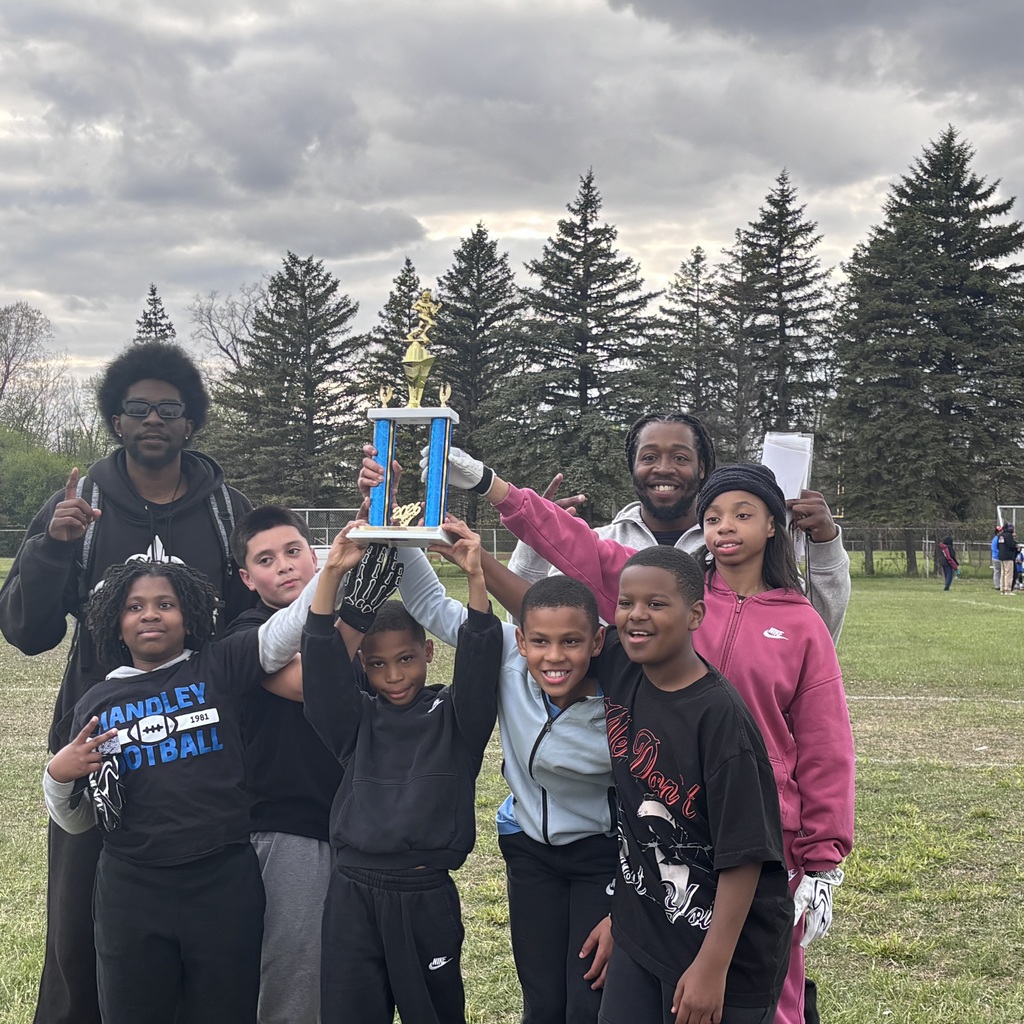 6 students looking at camera all holding a trophy. 2 coaches in the picture behind the student athletes