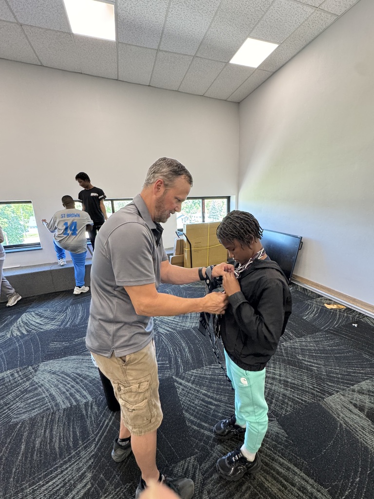Student graduates of the Power of Dad mentorship program at Saginaw Middle School