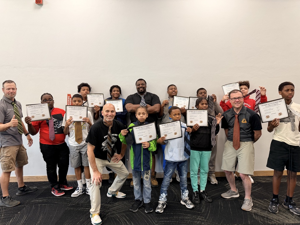 Student graduates of the Power of Dad mentorship program at Saginaw Middle School
