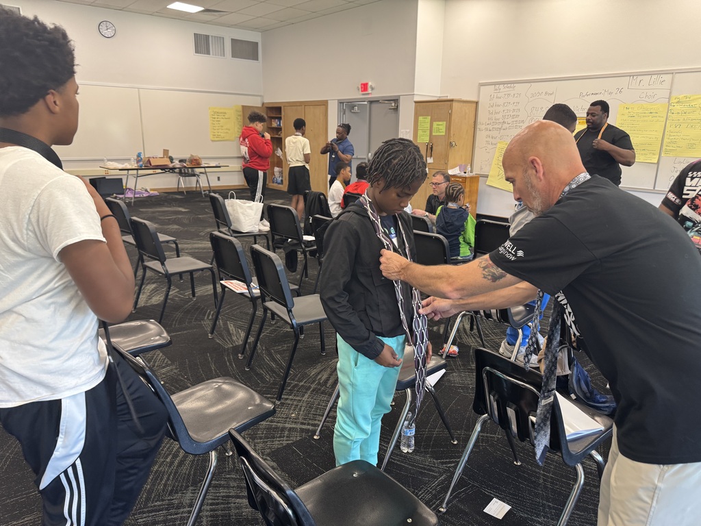 Student graduates of the Power of Dad mentorship program at Saginaw Middle School