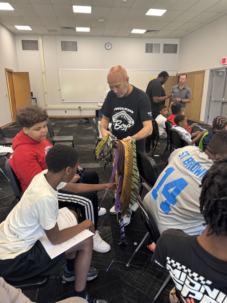 Student graduates of the Power of Dad mentorship program at Saginaw Middle School