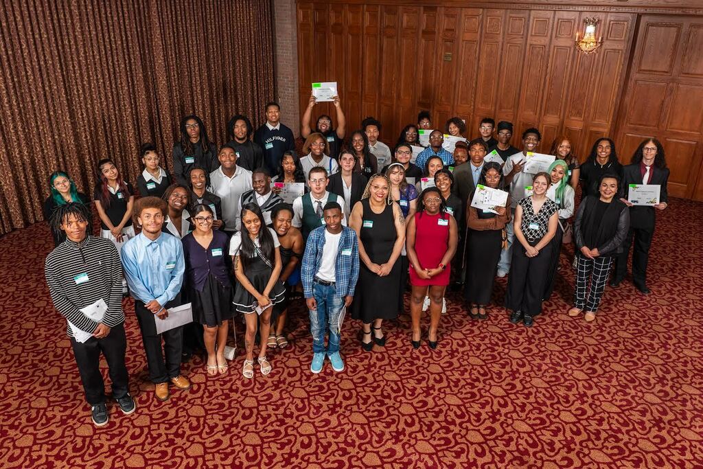 Group photo of Saginaw Promise Scholars with Deborah Sanchez at the Excellence in Education event celebrating scholarship awards.