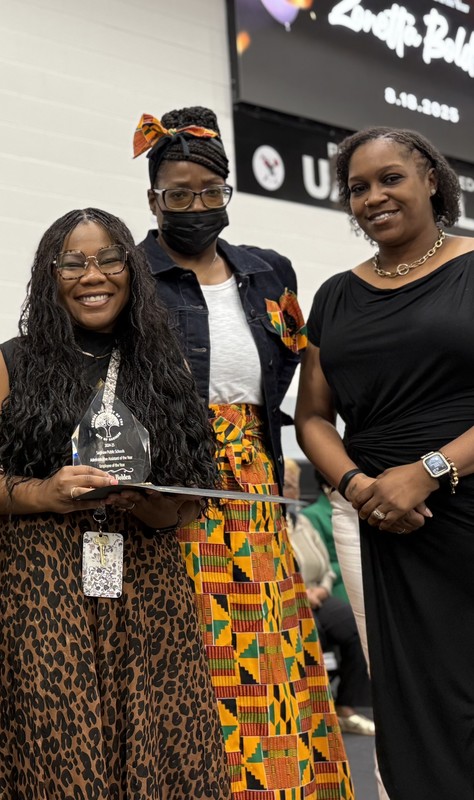 Zanetta Bolden accepts award for Administrative Assistant of the Year