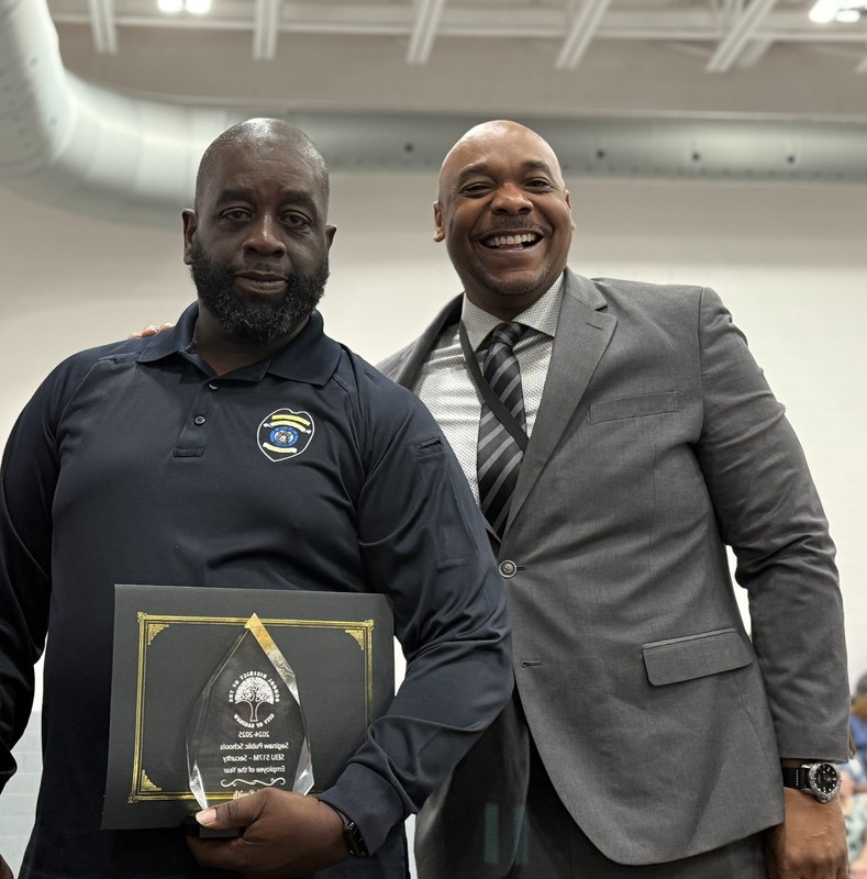 L.W. Smith accepts Employee of the Year award