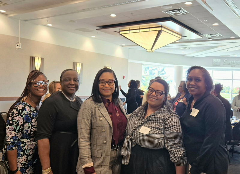 Human resources team pose for a picture