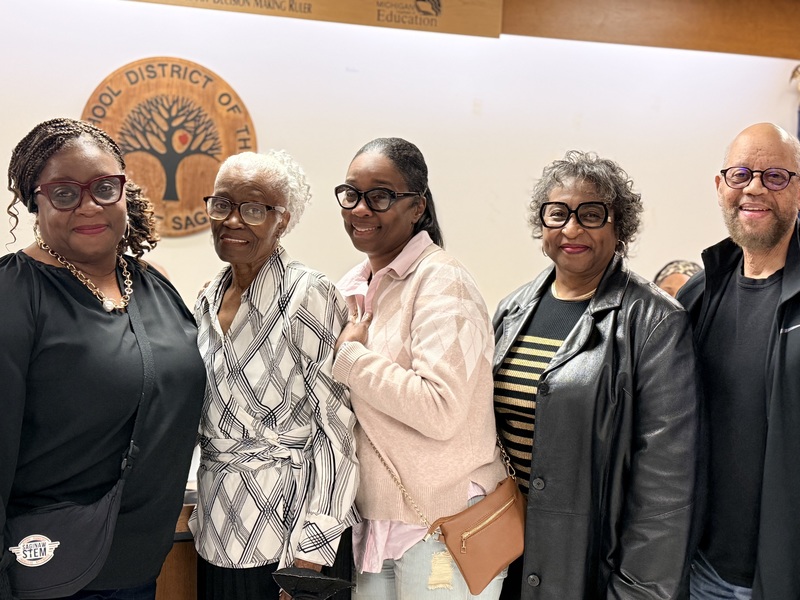 Family members gather at board meeting