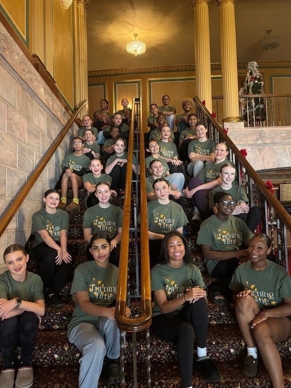 Students posing on a staircase