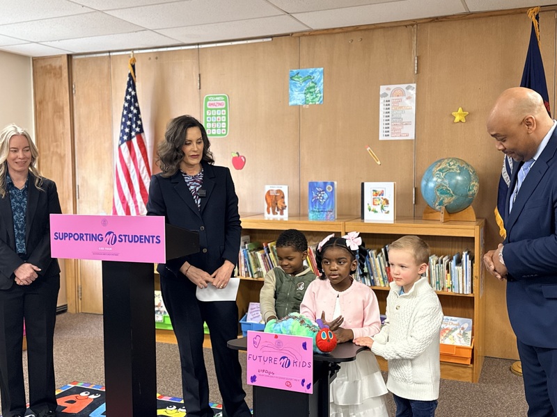 Students introduce Gov. Whitmer at the podium