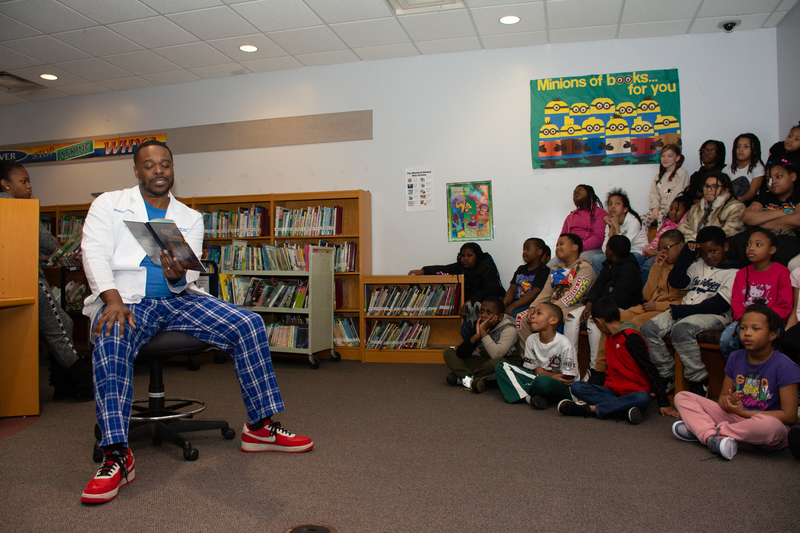Dr. Allen reads to students