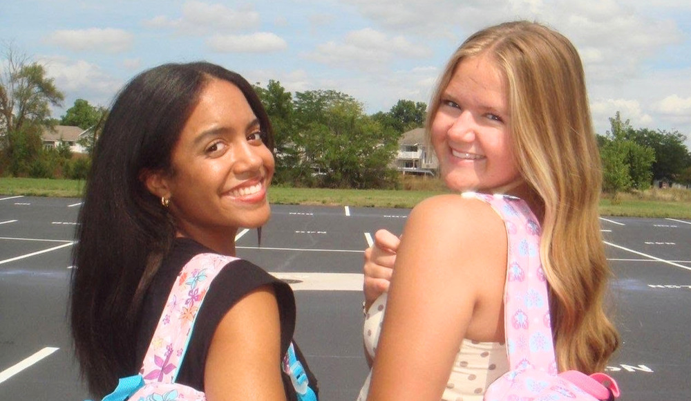 two girls smiling