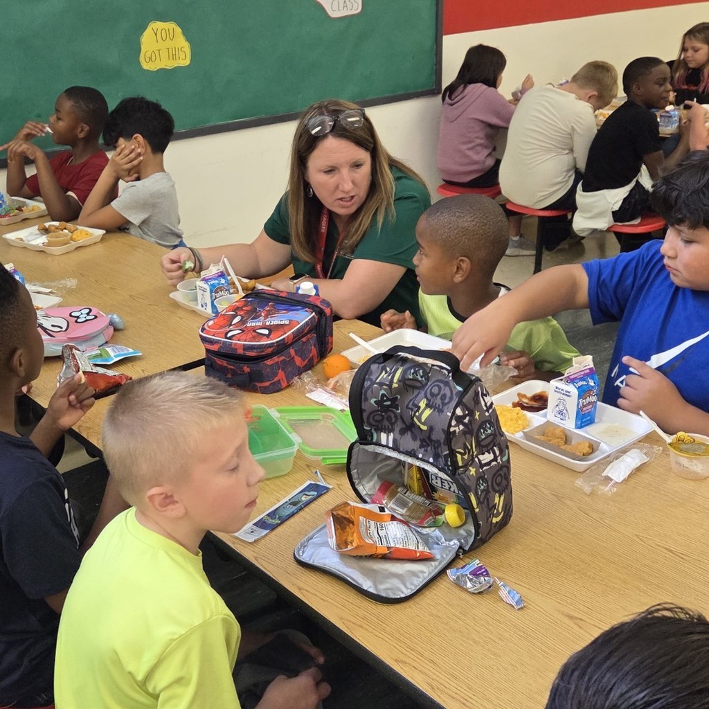 Ms. D'Haene was found enjoying her lunch while getting to know some of our newest Eagles in the cafeteria today 🍽 🦅