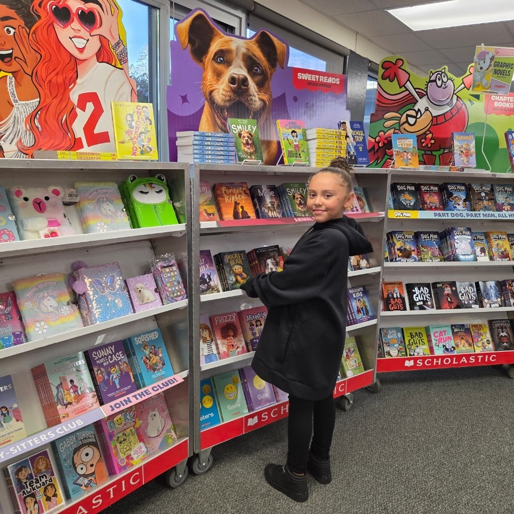 student shops at the book fair