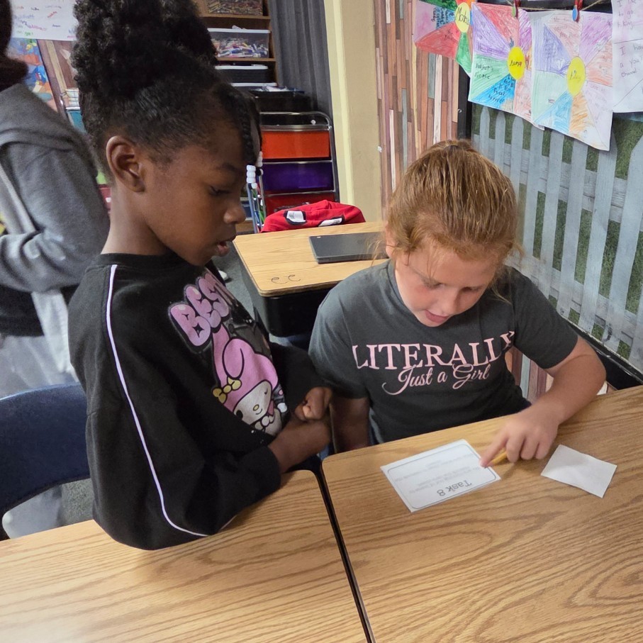 2 students read task card