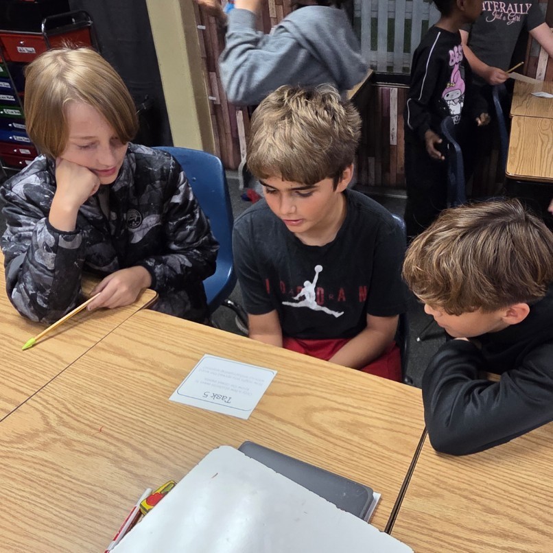 3 boys read task card