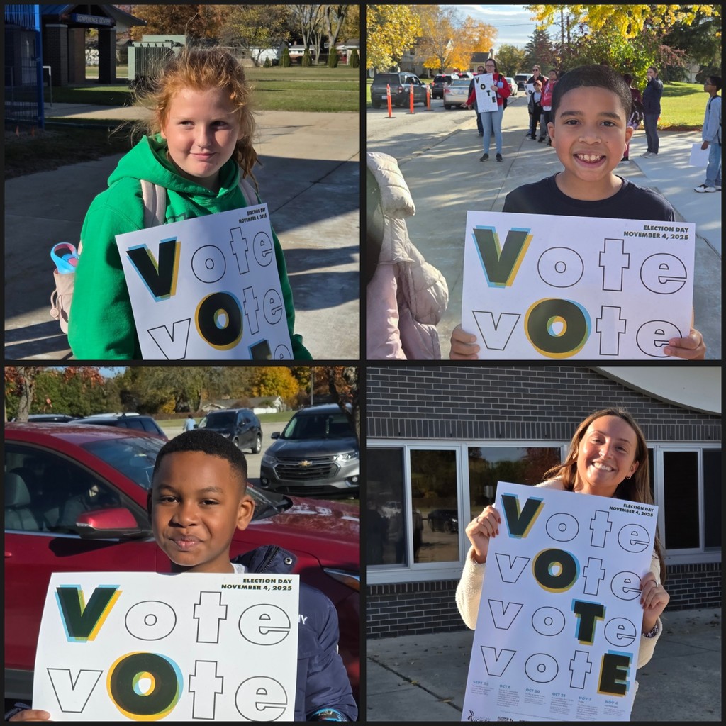 students and teacher hold VOTE signs