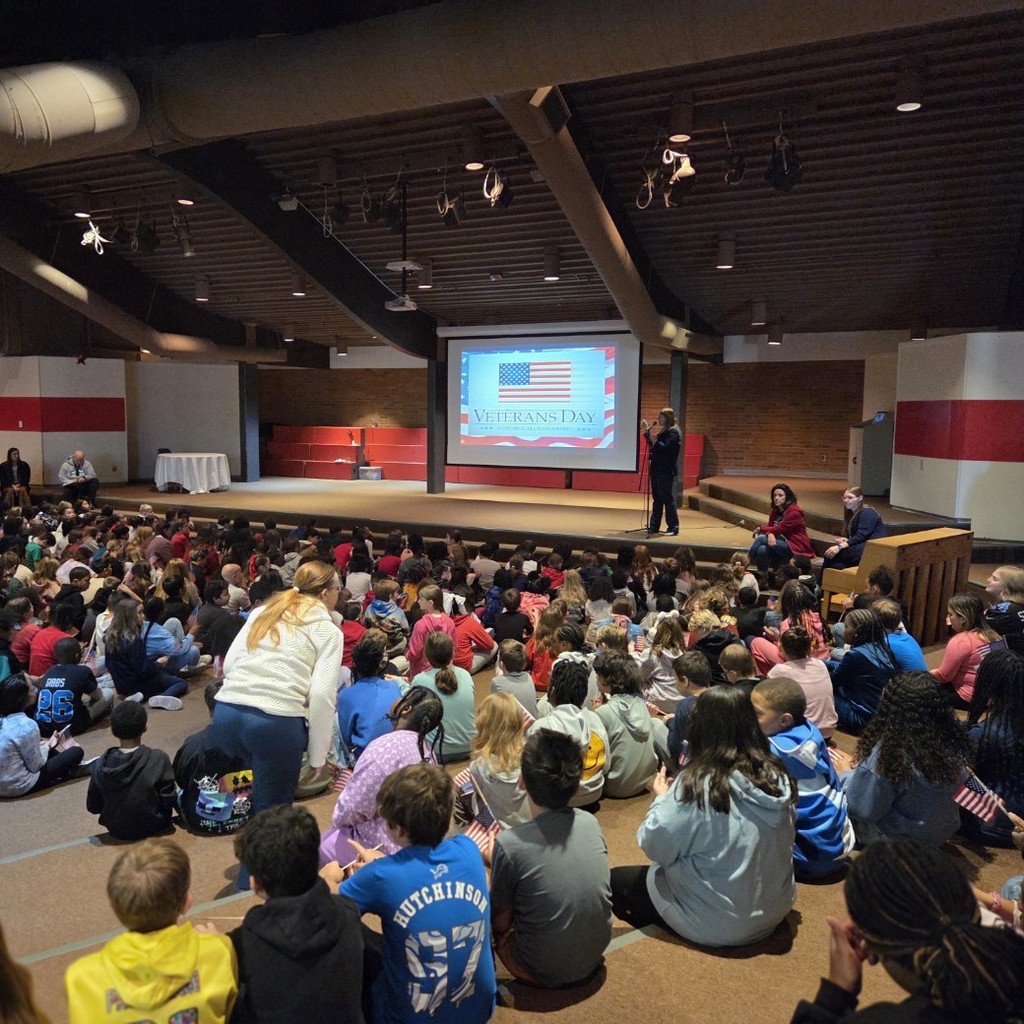 principal welcomes students and guests
