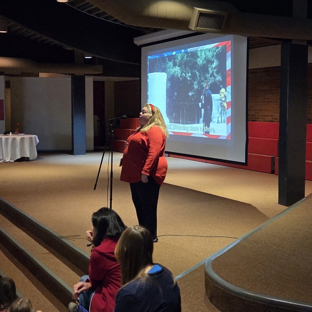 music teacher leads a song