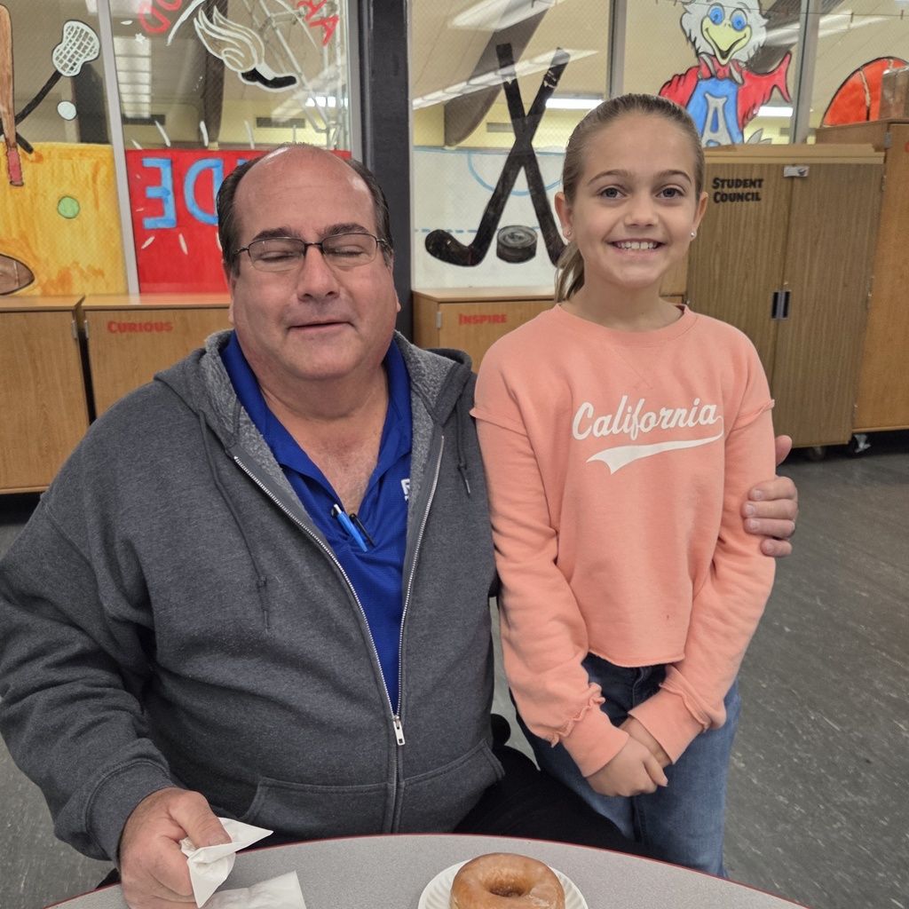 student smiles with grandpa