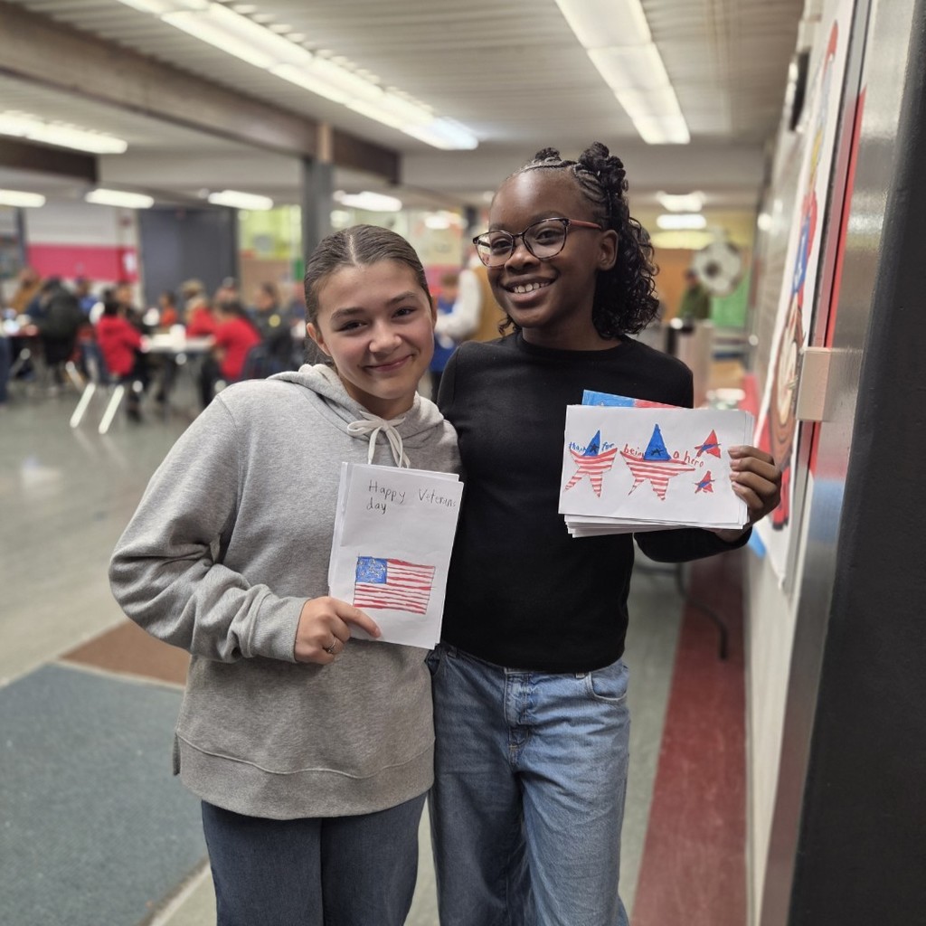 student council reps smile with handmade cards