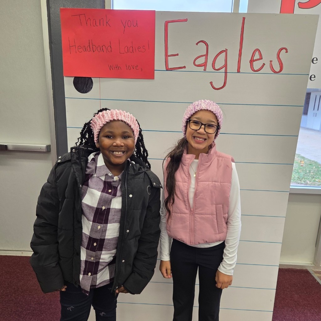 two girls with pink headbands