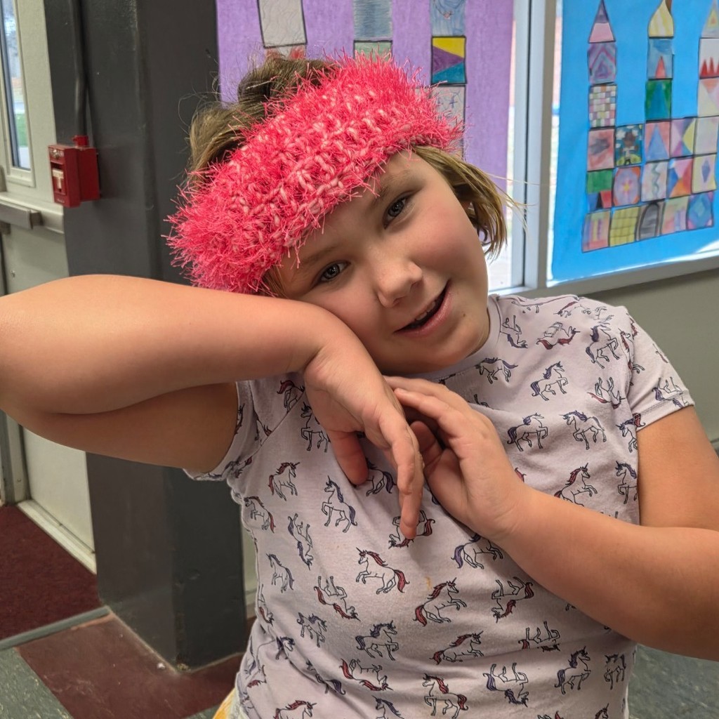 student shows off her new headbands