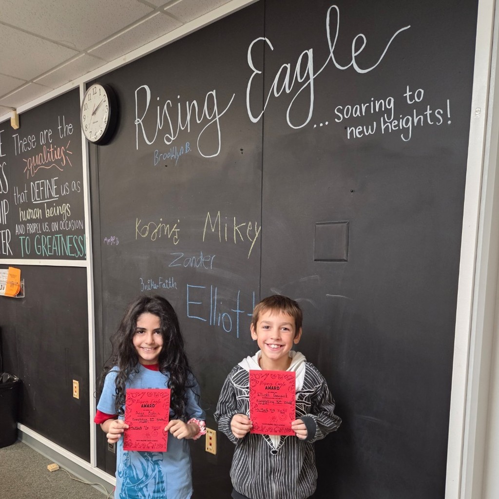 two students with Rising Eagle awards