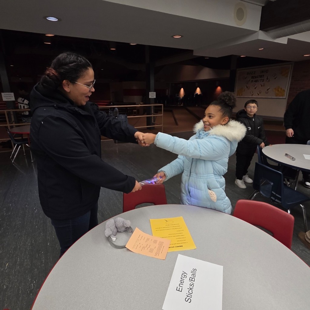 mom and daughter at energy sticks station