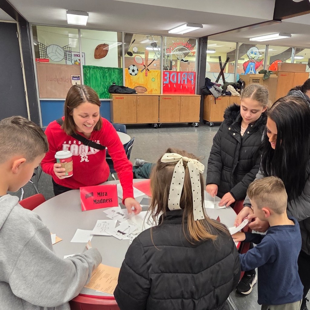 a family with teacher exploring mirrors