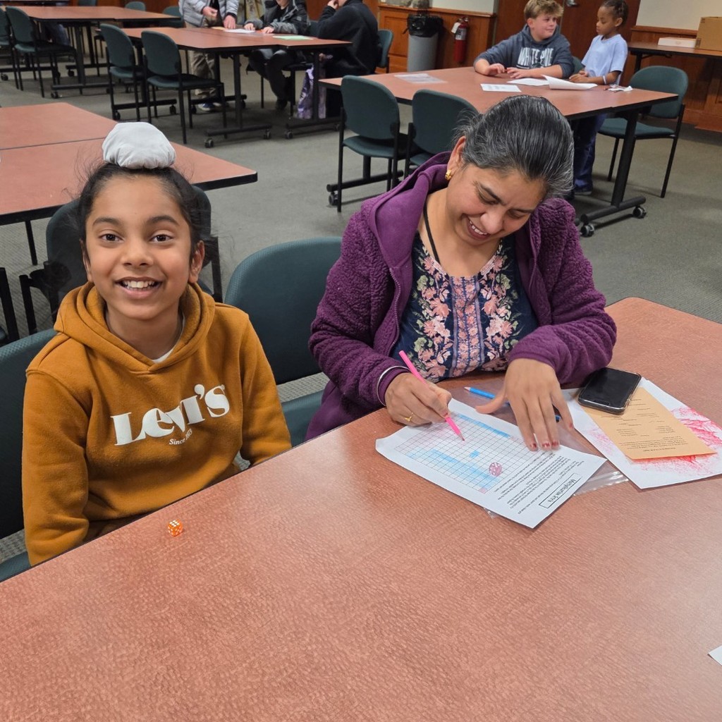 student plays multiplication Tetris with mom