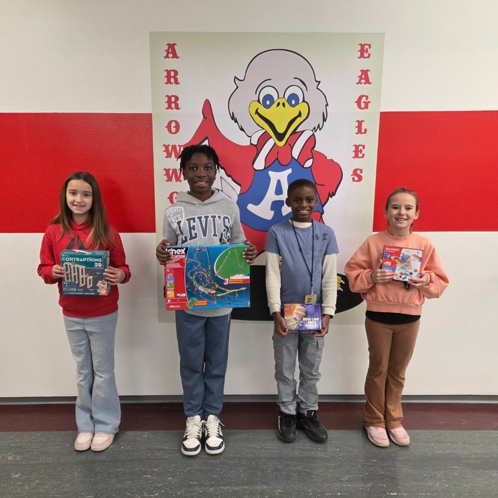 4 students smile with games