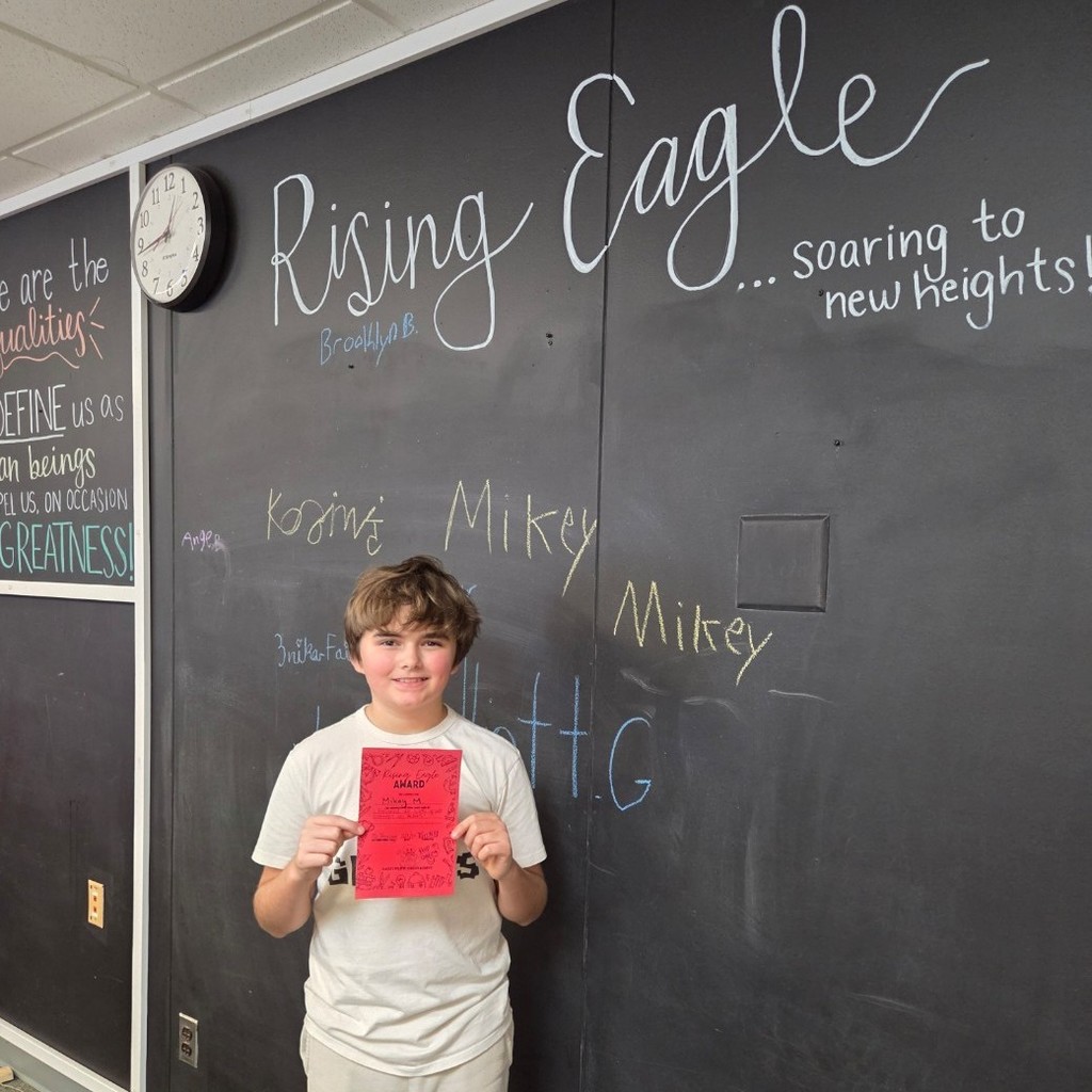 student holds certificate