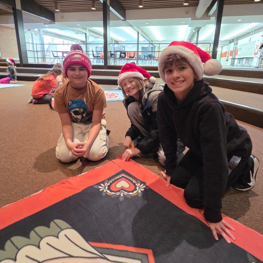 3 5th grade boys with fleece blanket