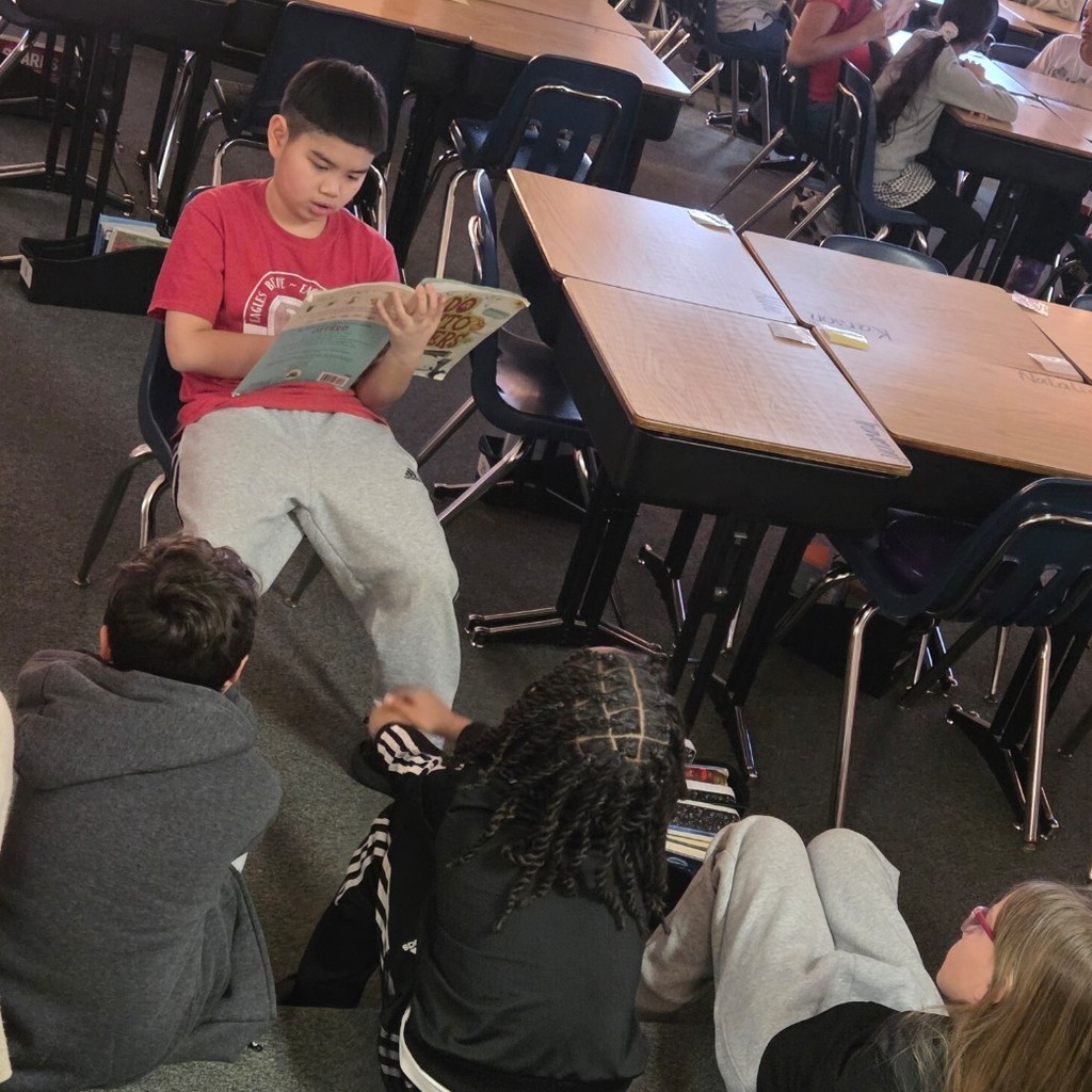 students look up at their reader