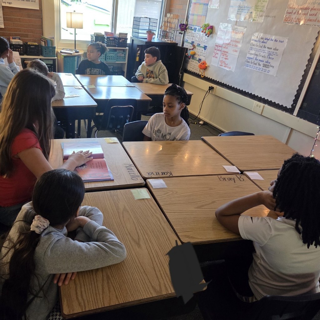 students listening to story at desks