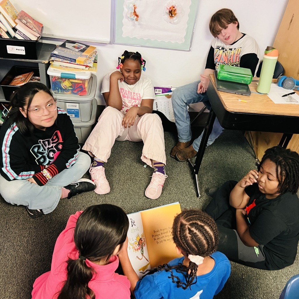 students read to older schoolmates