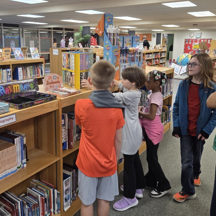 students shop for bookmarks