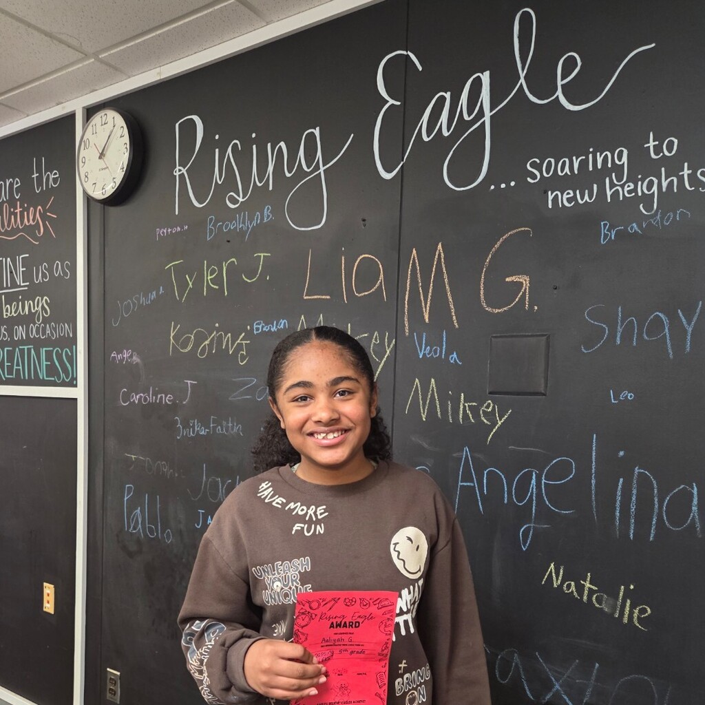 student with signed certificate