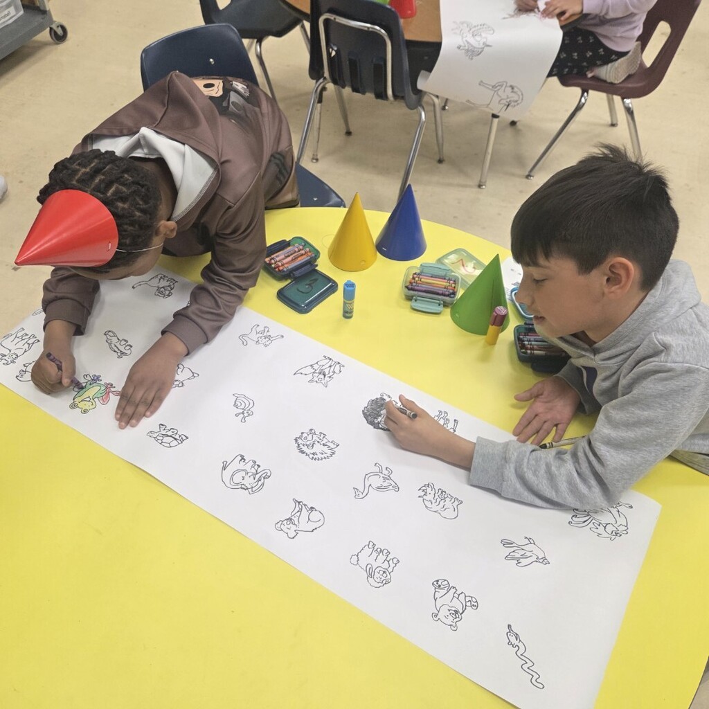 two boys color animal paper