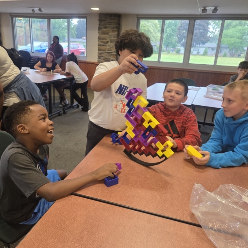 4 boys balance pieces in game