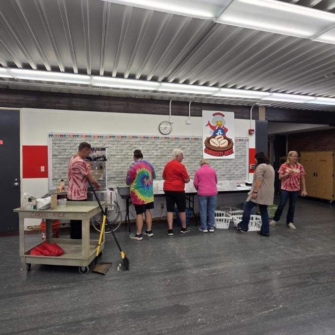 volunteers pop popcorn