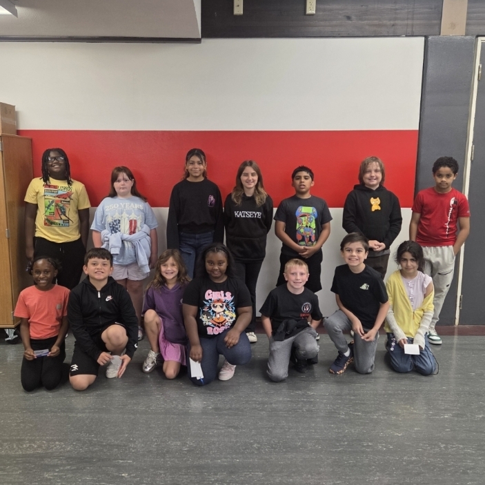 students pose in two rows
