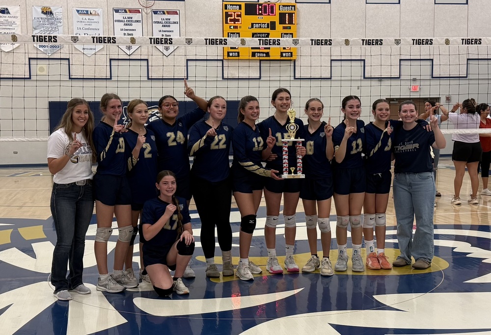 Middle school volleyball team and coaches