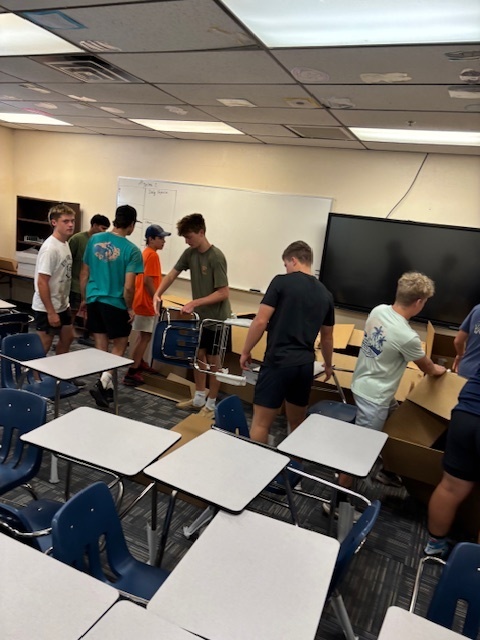 boys helping  with boxes