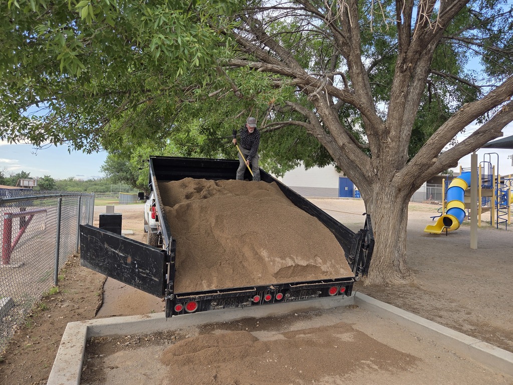 Mr. Grapp shoveling sand